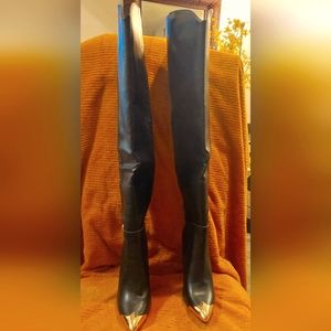 Black, over the knee boots, 4 in heel, inner calf zipper.